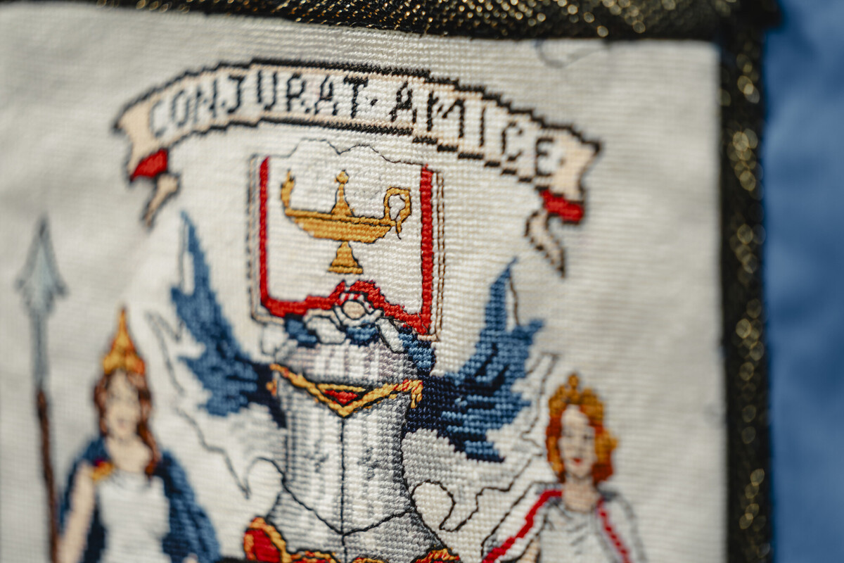 Tapestry with College crest embroidered.